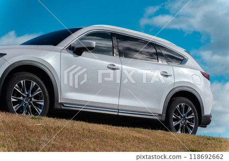 white SUV type passenger car white SUV type passenger car 118692662