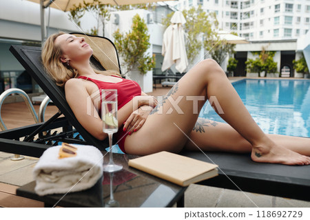 Relaxing by Poolside on a Sunny Day 118692729