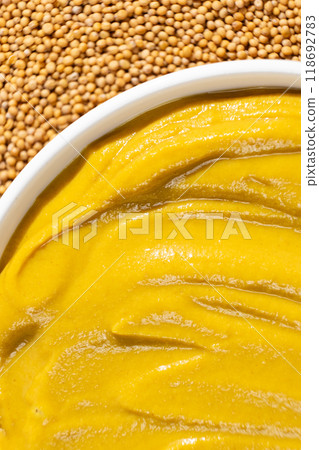 Mustard sauce and dry mustard seeds, top view. Mustard sauce and dry mustard seeds, top view. 118692783