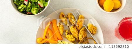 This flavorful meal includes fried zucchini flowers in golden batter, a tender cauliflower omelette with stewed peppers, and a colorful mixed green salad, ideal for a healthy diet, banner This flavorful meal includes fried zucchini flowers in golden batter, a tender cauliflower omelette with stewed peppers, and a colorful mixed green salad, ideal for a healthy diet, banner 118692810