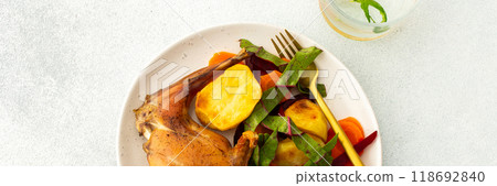 This gourmet dinner features succulent baked rabbit, golden roasted potatoes, and a fresh carrot salad, offering a nutritious, hearty, and savory option for a memorable meal, banner This gourmet dinner features succulent baked rabbit, golden roasted potatoes, and a fresh carrot salad, offering a nutritious, hearty, and savory option for a memorable meal, banner 118692840