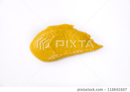 Smear of mustard sauce on white background isolate, creativity in cooking, macro texture Smear of mustard sauce on white background isolate, creativity in cooking, macro texture 118692887