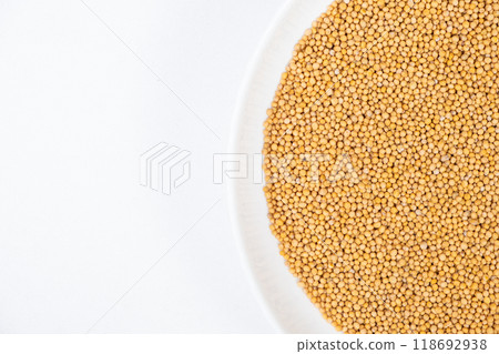 Mustard grains on white background, copy space for text 118692938