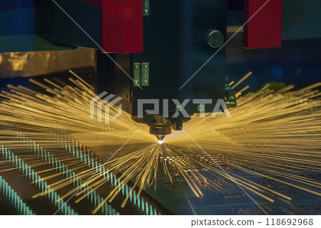 The fiber laser cutting machine cut the metal plate with the sparkling light. The fiber laser cutting machine cut the metal plate with the sparkling light. 118692968