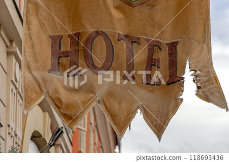 Old Hotel Torn Flag Old Hotel Torn Flag 118693436