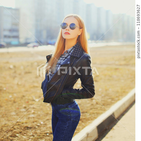 Fashion portrait beautiful blonde woman posing in rock black style at city Fashion portrait beautiful blonde woman posing in rock black style at city 118693627