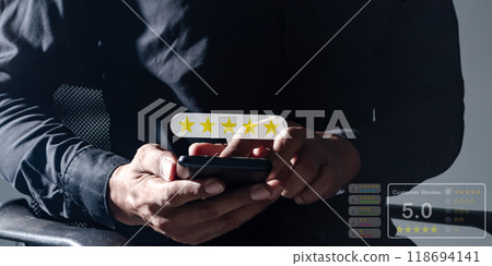 Customer Review, Young Man hand using smartphone mobile touch five star to review and give 5 stars Customer Review, Young Man hand using smartphone mobile touch five star to review and give 5 stars 118694141