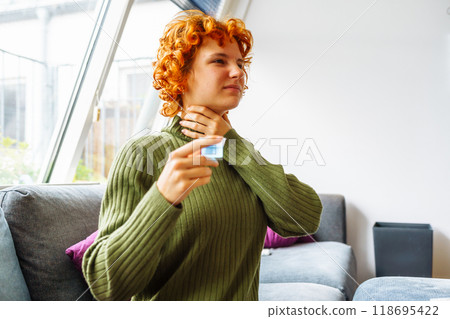 portrait of a young woman with a cold portrait of a young woman with a cold 118695422