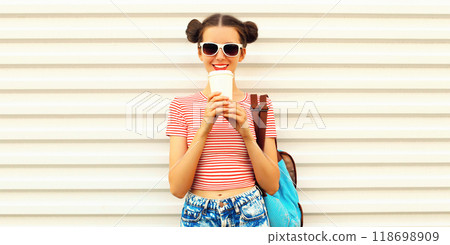 Portrait of happy smiling young woman drinking coffee with cool hairstyle on white background Portrait of happy smiling young woman drinking coffee with cool hairstyle on white background 118698909