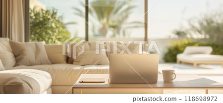 A laptop is on a table in a living room with a cup of coffee next to it by AI generated image 118698972