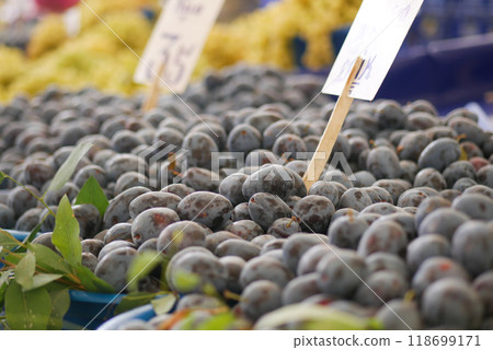 Fresh and ripe Plums displayed beautifully at the Market Stall along with Pricing Tags Fresh and ripe Plums displayed beautifully at the Market Stall along with Pricing Tags 118699171