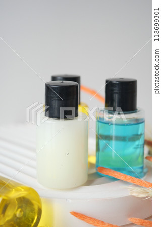 Assortment of Small Bottles with Skincare and Spa Products on Clean White Background 118699301