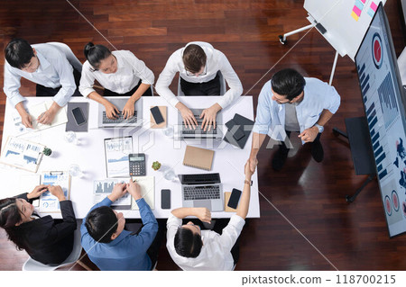 Analyst team utilizing BI Fintech to analyze financial data at table. Prudent Analyst team utilizing BI Fintech to analyze financial data at table. Prudent 118700215