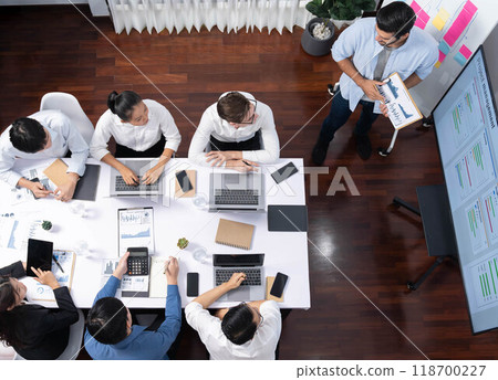 Analyst team utilizing BI Fintech to analyze financial data at table. Prudent Analyst team utilizing BI Fintech to analyze financial data at table. Prudent 118700227