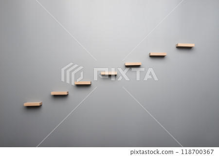Graph or wooden steps on grey background in a concept of vision Graph or wooden steps on grey background in a concept of vision 118700367