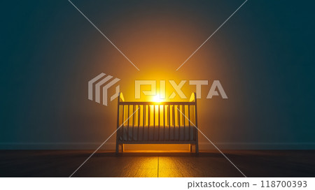 Empty cradle illuminated by a light at night in a room 118700393