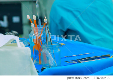 Preparation of sterile surgical instruments during an operation in hospital operating room. 118700590