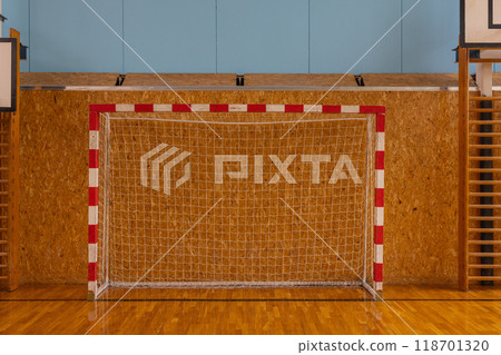 Indoor Soccer Goal in School Gymnasium with Wooden Floor and Equipment. Indoor Soccer Goal in School Gymnasium with Wooden Floor and Equipment. 118701320