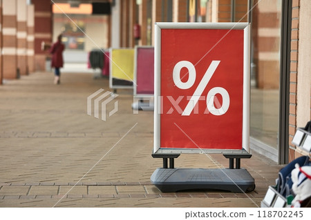 Discount sale sign in front of a shop Discount sale sign in front of a shop 118702245