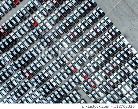 Auto industry. New vehicles in factory parking. Pickup truck and SUV. Fuel efficiency, emissions standards. Electric and hybrid technology. Logistics business. Import and export new cars at warehouse. 118702326