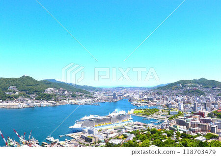 Nagasaki city and a luxury cruise ship anchored at Nagasaki Port 118703479
