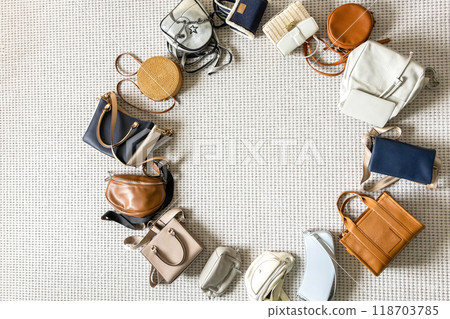 Fashionable, trendy, stylish bags of various sizes and types are laid out in a circle on the floor Fashionable, trendy, stylish bags of various sizes and types are laid out in a circle on the floor 118703785