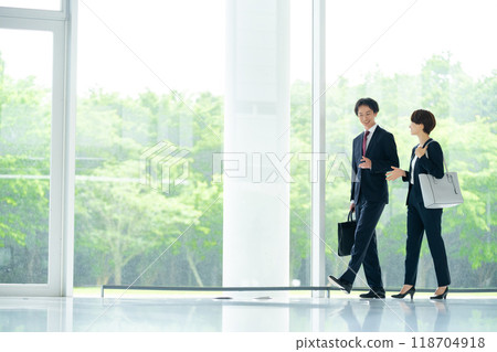 Male and female employees business image Male and female employees business image 118704918