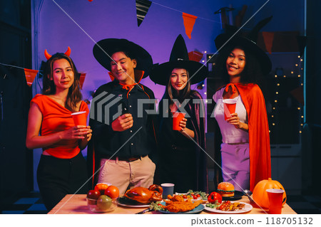 Joyful office Halloween party with coworkers in costumes, celebrating with drinks and laughter, fostering teamwork and festive spirit 118705132