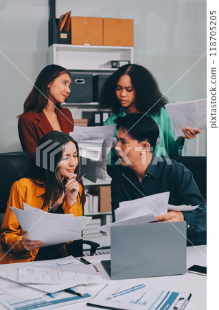 Stress, business people and employee frustrated with multitasking, pressure or overworked by team in chaos with paperwork. Anxiety, headache and worker overwhelmed by group and burnout in crisis 118705205