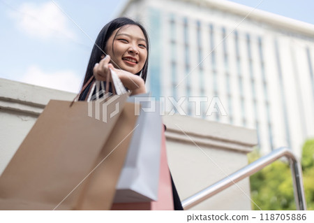 Joyful Shopper Finds Delight in Black Friday Bargains with Stylish Purchases Joyful Shopper Finds Delight in Black Friday Bargains with Stylish Purchases 118705886