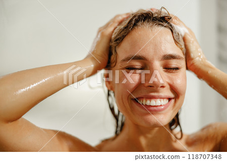 A Joyful Woman Delighting in an Invigorating Shower Experience That Uplifts Her Mood A Joyful Woman Delighting in an Invigorating Shower Experience That Uplifts Her Mood 118707348