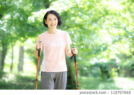 Middle-aged woman enjoying walking 118707668