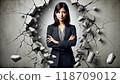 A woman in a suit breaking through a wall 118709012
