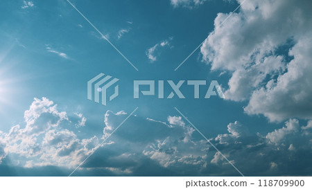 Sunbeam With Haze On Blue Sky. Beams With Clouds. Sky With Sun Coming With Clouds. 118709900