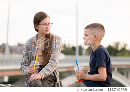 Children communicate and drink bubble tea Children communicate and drink bubble tea 118710769