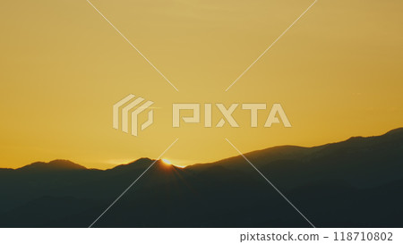 Rays Over Hills Or Mountain On Silhouette View. Decorative. Wild Nature Landscape. Dramatic Sky. Rays Over Hills Or Mountain On Silhouette View. Decorative. Wild Nature Landscape. Dramatic Sky. 118710802
