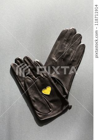 A pair of gloves with a yellow heart 118711914