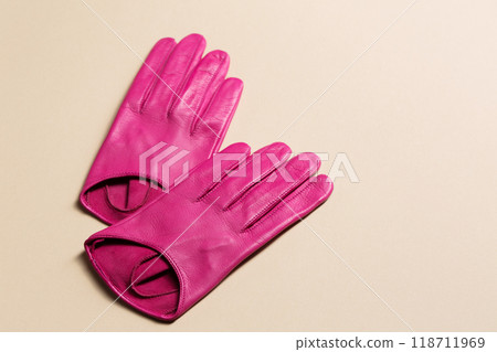 A pair of bright pink plain gloves A pair of bright pink plain gloves 118711969