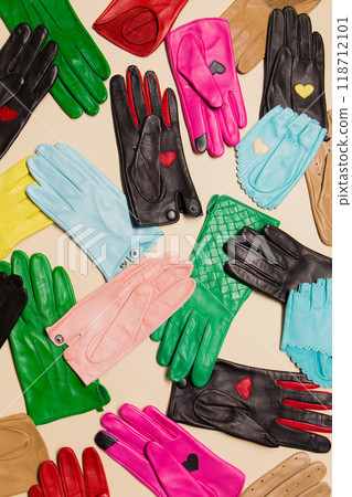 Bright gloves on a beige background 118712101