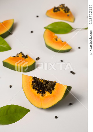 Fruit background made of pieces of ripe papaya on a white 118712133