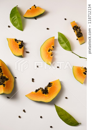 Fruit background made of pieces of ripe papaya Fruit background made of pieces of ripe papaya 118712134