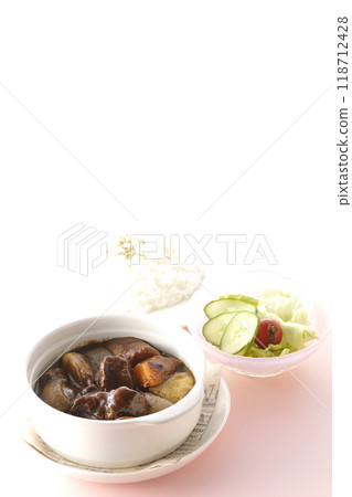 A set of beef stew with chunks of meat and vegetables, rice and salad A set of beef stew with chunks of meat and vegetables, rice and salad 118712428