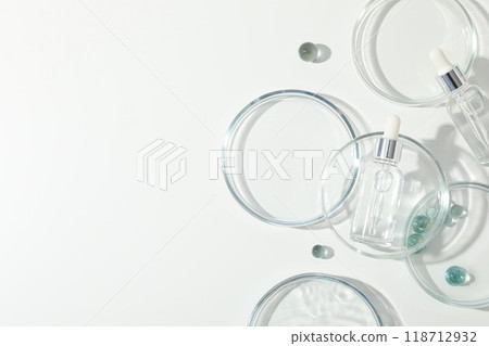Transparent cosmetic bottles on a white background 118712932