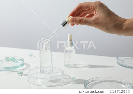 Transparent cosmetic bottles on a white background 118712933