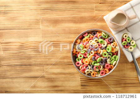 Colorful cornflakes, concept of tasty breakfast, morning food, space for text 118712961
