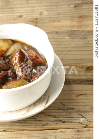 Beef stew with lots of meat and vegetables 118713691