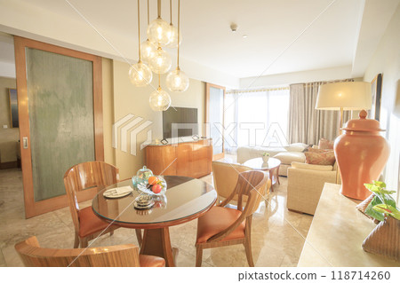 Luxury resort hotel suite interior (combined living and dining space) Luxury resort hotel suite interior (combined living and dining space) 118714260
