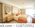 Tropical resort suite bedroom 118715052