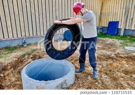 Installation of support ring for septic tank manhole cover made of concrete rings. Installation of support ring for septic tank manhole cover made of concrete rings. 118715535
