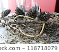 Close-Up of Pine Cones and Twigs on Textured Surface 118718079